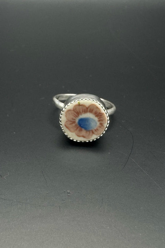 Floral design on ring on a black background