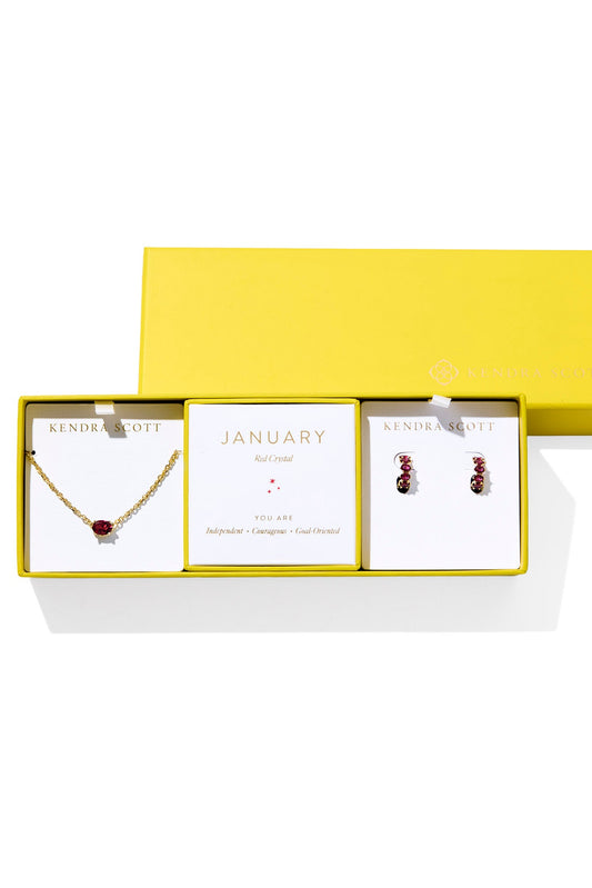 Jewelry set with necklace and earrings in a yellow box on a white background