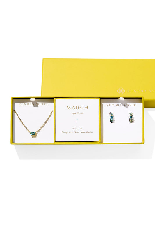 Jewelry set with necklace and earrings in a yellow box on a white background